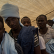 Refugees and migrants are seen waiting to disembark the Migrant Offshore Aid Station Phoenix vessel after arriving in port on June 12, 2017, in Reggio Calabria, Italy. (Chris McGrath/Getty Images)